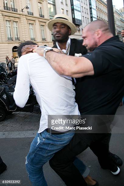 Bodyguard Pascal Duvier and french security agent immobilize Vitalii Sediuk after jumping on Kim Kardashian West at 'L'Avenue' restaurant on...