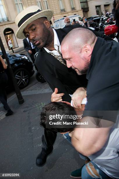 Bodyguard Pascal Duvier and french security agent immobilize Vitalii Sediuk after jumping on Kim Kardashian West at 'L'Avenue' restaurant on...