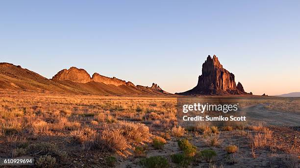 shiprock at sunrise, new mexico - new mexico foto e immagini stock