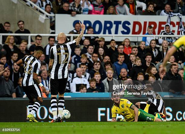 Yoan Gouffran of Newcastle United brings down Steven Whittaker of Norwich City in the box during the Sky Bet Championship match between Newcastle...