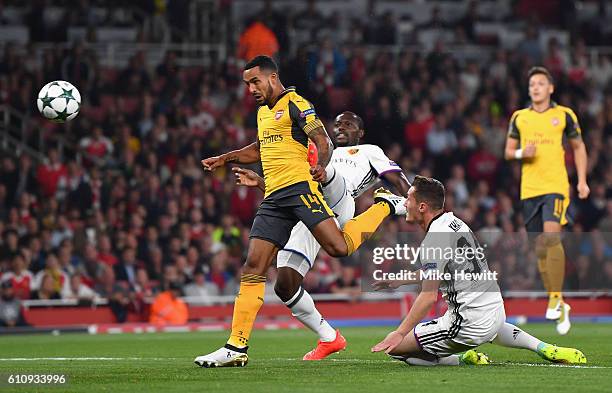 Theo Walcott of Arsenal scores the opening goal during the UEFA Champions League group A match between Arsenal FC and FC Basel 1893 at the Emirates...