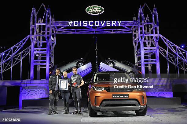 Bear Grylls, Zara Phillips and Sir Ben Ainslie pose with a certificate to recognise the official Guinness World Record for the Number of Lego pieces...
