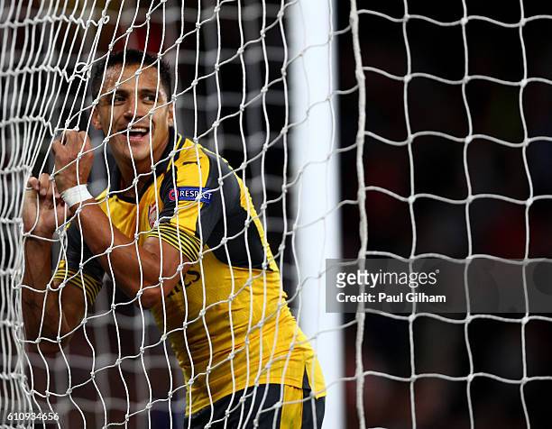 Alexis Sanchez of Arsenal reacts to a missed opportunity during the UEFA Champions League group A match between Arsenal FC and FC Basel 1893 at the...