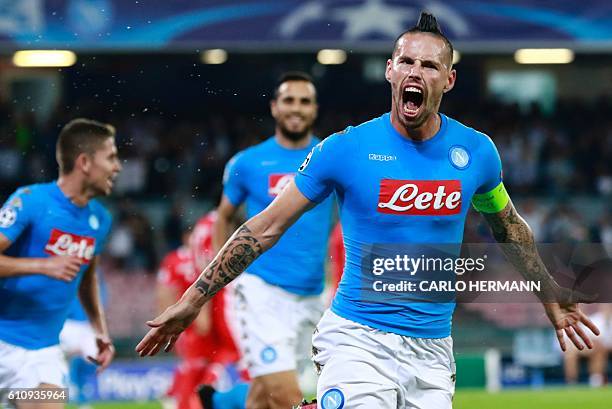 Napoli's midfielder from Slovakia Marek Hamsik celebrates after scoring during the UEFA Champions League football match SSC Napoli vs SL Benfica on...