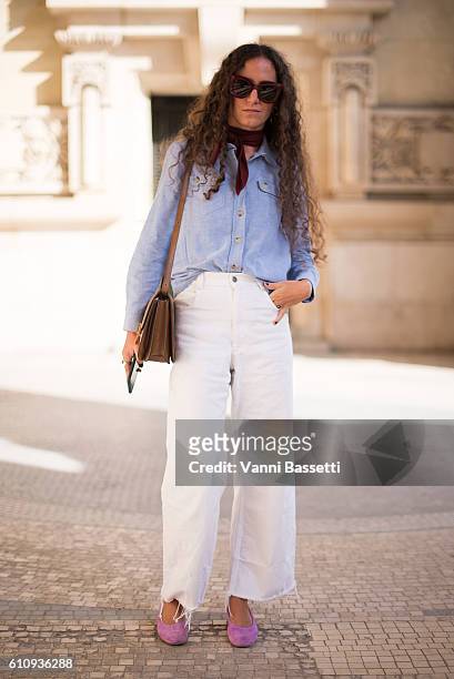 Ondine Azoulay poses wearing an APC shirt and Celine shoes after the Maison Martin Margiela show at the Grand Palais during Paris Fashion Week...
