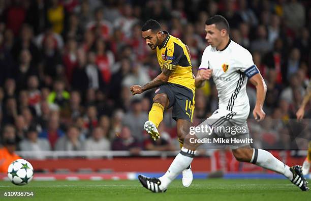 Theo Walcott of Arsenal scores his team's second goal during the UEFA Champions League group A match between Arsenal FC and FC Basel 1893 at the...