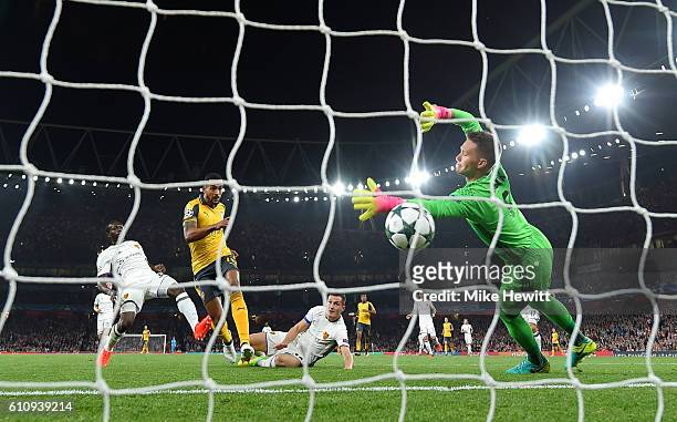 Theo Walcott of Arsenal scores the opening goal during the UEFA Champions League group A match between Arsenal FC and FC Basel 1893 at the Emirates...