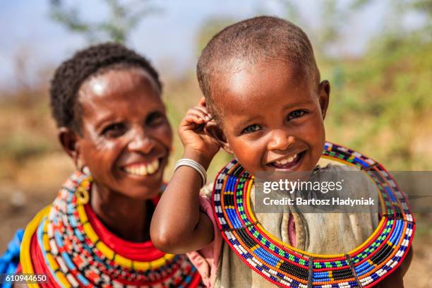 african woman sitting with her baby, kenya, east africa - kenya children stock pictures, royalty-free photos & images