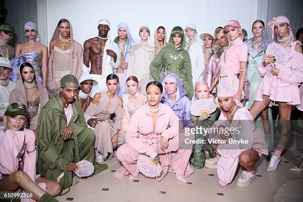 Rihanna is seen with models backstage during FENTY x PUMA by Rihanna at Hotel Salomon de Rothschild on September 28, 2016 in Paris, France.