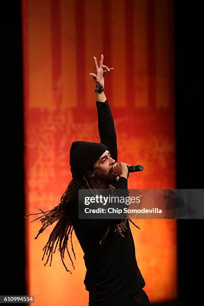 Hip hop artist Dee-1, David Augustine Jr., performs his song 'Sallie Mae Back' during the Washington Ideas Forum at the Harman Center for the Arts...