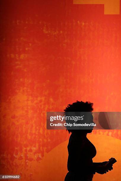 Author Chimamanda Ngozi Adichie leaves the stage following an interview during the Washington Ideas Forum at the Harman Center for the Arts September...