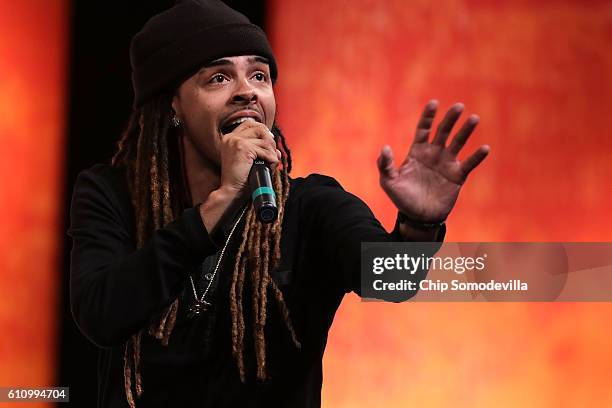 Hip hop artist Dee-1, David Augustine Jr., performs his song 'Sallie Mae Back' during the Washington Ideas Forum at the Harman Center for the Arts...