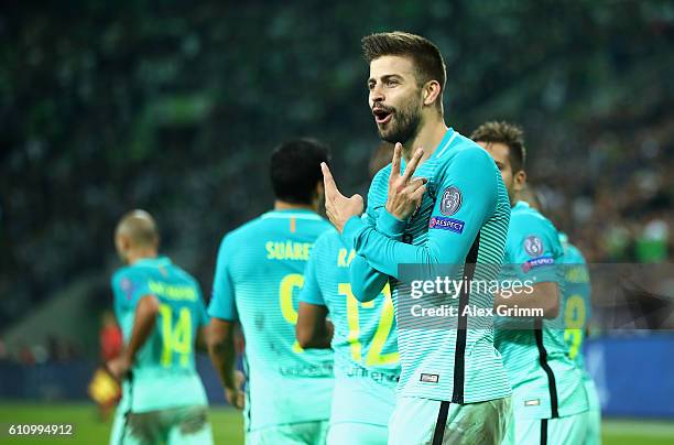 Gerard Pique of Barcelona celebrates with team-mate after scoring his team;s second goal during the UEFA Champions League group C match between VfL...