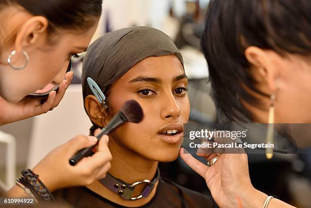 Model has makeup applied backstage during FENTY x PUMA by Rihanna at Hotel Salomon de Rothschild on September 28, 2016 in Paris, France.