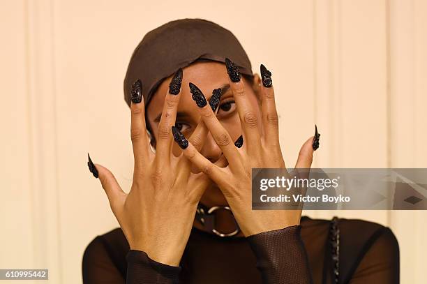 Model, hand detail, poses backstage during FENTY x PUMA by Rihanna at Hotel Salomon de Rothschild on September 28, 2016 in Paris, France.