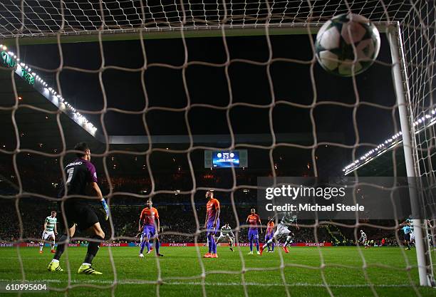 Moussa Dembele of Celtic scores his team's third goal during the UEFA Champions League group C match between Celtic FC and Manchester City FC at...