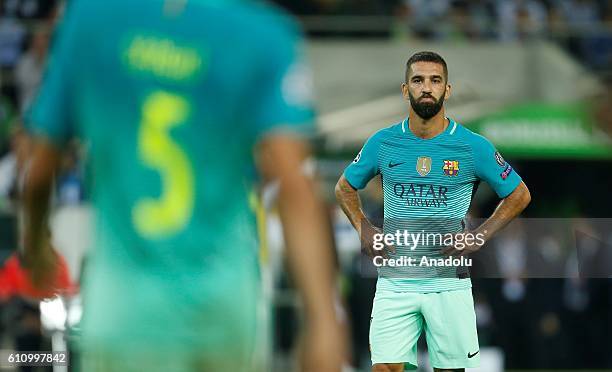 Arda Turan stands on the pitch after the 2-1 victory against Moenchengladbach at the UEFA Champions League group C soccer match between Borussia...