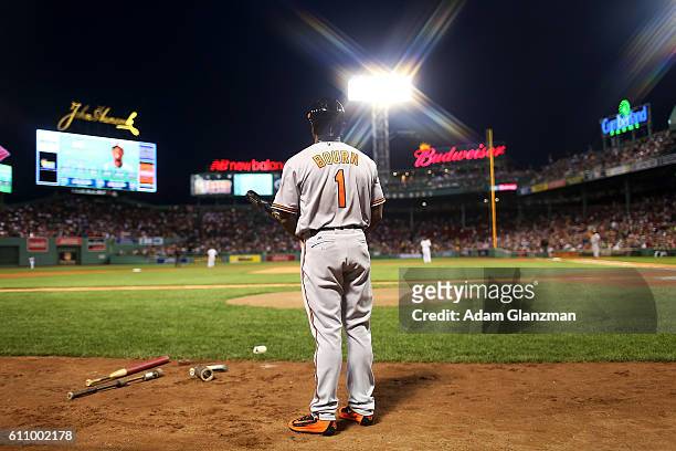 Michael Bourn of the Baltimore Orioles warms up in the on deck circle in the first inning of a game against the Boston Red Sox at Fenway Park on...