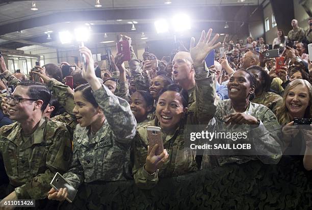 Members of US military cheer as US President Barack Obama arrives to speak at Fort Lee, Virginia, September 28, 2016. The United States will send...