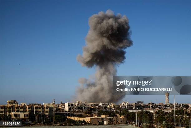 Smoke rise after an airstrike on the District 3 of Sirte, the last stronghold of Islamic State on September 28, 2016. France will host an...