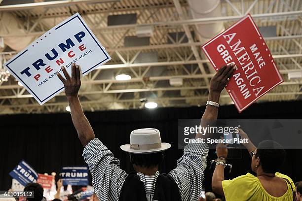 Donald Trump supporters cheer as he speaks at a rally on September 28, 2016 in Council Bluffs, Iowa. Trump has been campaigning today in Iowa,...