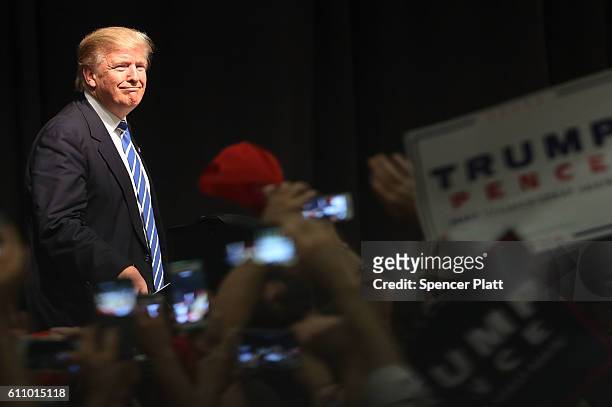 Donald Trump walks on stage at a rally on September 28, 2016 in Council Bluffs, Iowa. Trump has been campaigning today in Iowa, Wisconsin and Chicago.