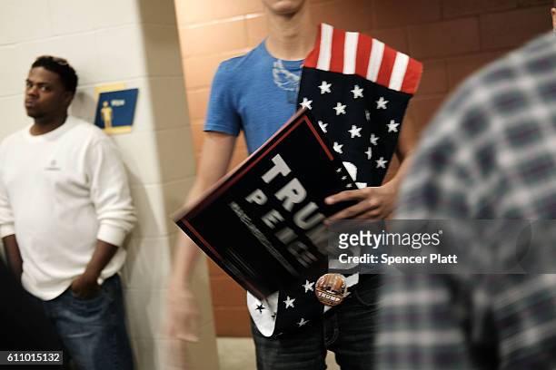 Donald Trump supporters wait for him to speaks at a rally on September 28, 2016 in Council Bluffs, Iowa. Trump has been campaigning today in Iowa,...