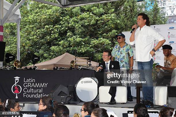 Colombian singer Carlos Vives and president of the Latin Recording Academy, Gabriel Abaroa attend the Latin Grammy en las Escuelas Mexico 2016 at...
