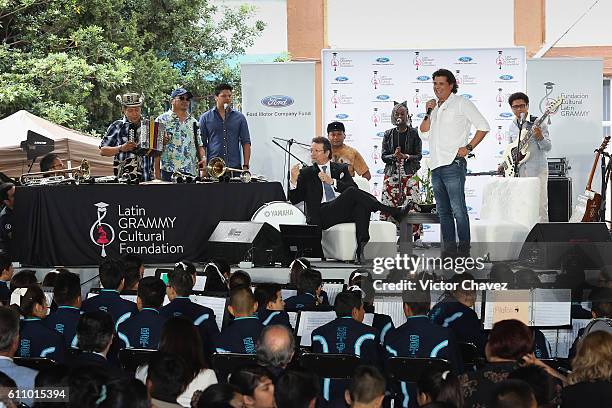 Colombian singer Carlos Vives and president of the Latin Recording Academy, Gabriel Abaroa attend the Latin Grammy en las Escuelas Mexico 2016 at...