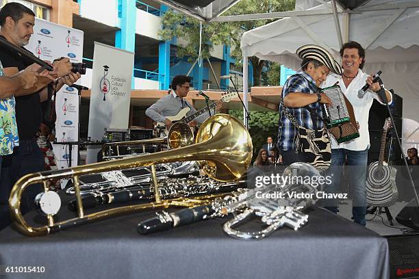 Colombian singer Carlos Vives speaks and performs onstage during the Latin Grammy en las Escuelas Mexico 2016 at Escuela Secundaria Tecnica 31...