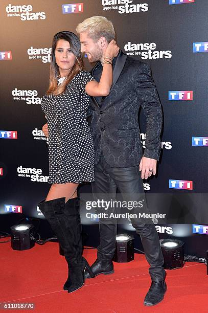 Karine Ferri and Yann Alrick Mortreuil pose during the 'Danses With The Stars' photocall on September 28, 2016 in Paris, France.