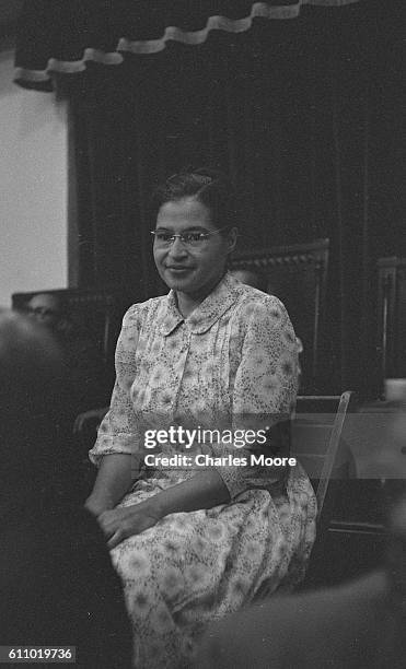 Portrait of American Civil Rights leader Rosa Parks as she sits during an unspecified event at the Holt Street Baptist Church, Montgomery, Alabama,...