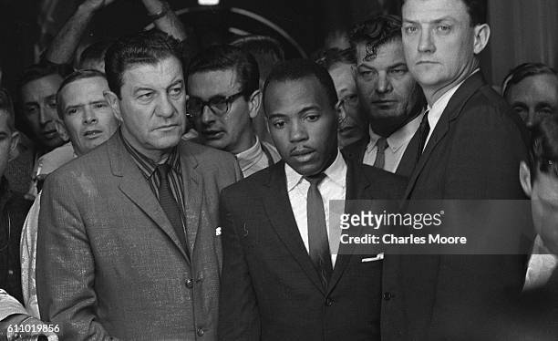 American Civil Rights activist and student James Meredith is escorted by Chief US Marshal James JP McShane and Assistant Attorney General for Civil...