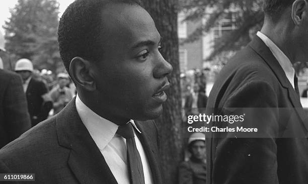 Close-up of American Civil Rights activist and student James Meredith as he is escorted, by US Marshals and various officials, on his way to register...