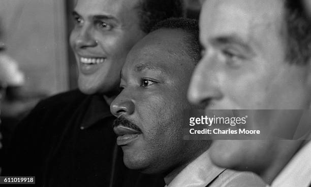 Close-up of, from left, musician Harry Belafonte, Civil Rights leader Dr Martin Luther King Jr , and musician Tony Bennett at the conclusion of the...