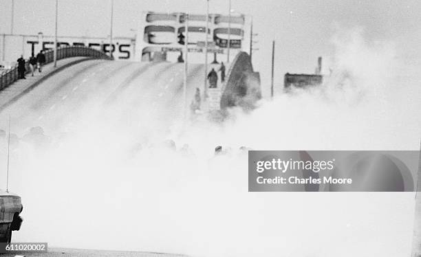 View of Civil Rights marchers in a cloud of tear gas at the base of the Edmund Pettus Bridge during the first Selma to Montgomery March, Selma,...