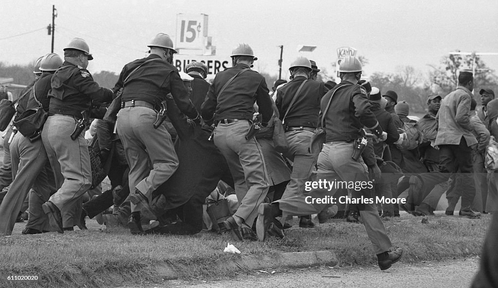 Police Charge At Demonstrators