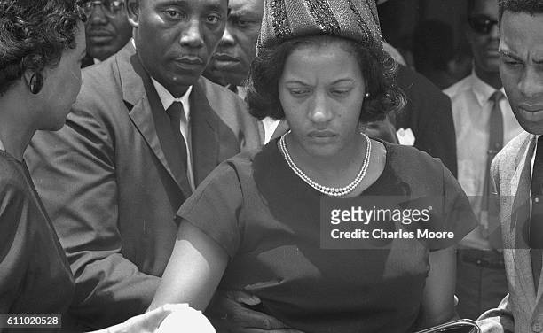 View of American Civil Rights activist Myrlie Evers as she arrives for the funeral of her husband, Medgar Evers, Jackson, Mississippi, June 15, 1963....