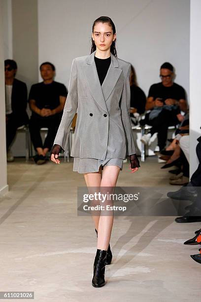 Model walks the runway during the Olivier Theysen show as part of the Paris Fashion Week Womenswear Spring/Summer 2017 on September 27, 2016 in...