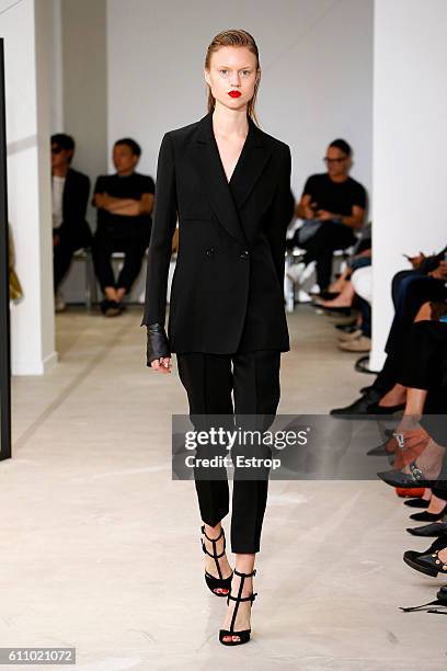 Model walks the runway during the Olivier Theysen show as part of the Paris Fashion Week Womenswear Spring/Summer 2017 on September 27, 2016 in...