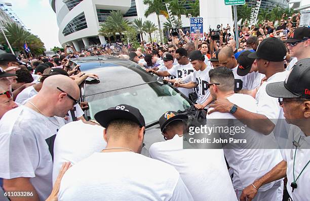 Miami Marlins owner, Jeffrey Loria, along with players and other members of the Marlins organization and their fans gather next to the hearse...