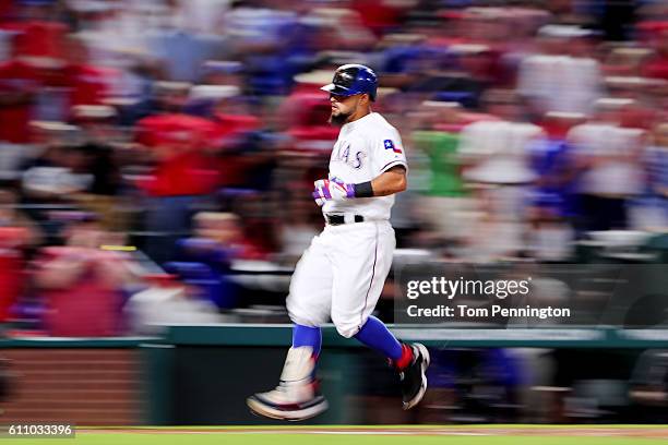 Rougned Odor of the Texas Rangers rounds the bases after hitting a two run home run against the Milwaukee Brewers in the top of the second inning at...