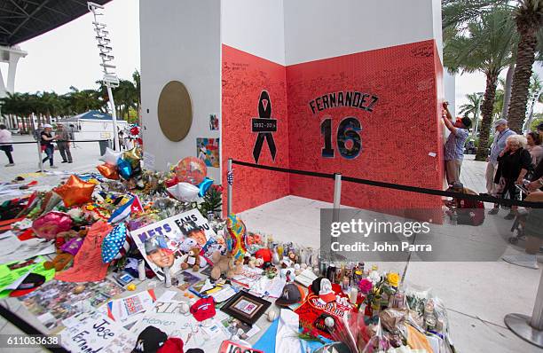 Atmosphere at a memorial before the hearse carrying Miami Marlins pitcher Jose Fernandez passes in front of the Marlins baseball stadium on September...