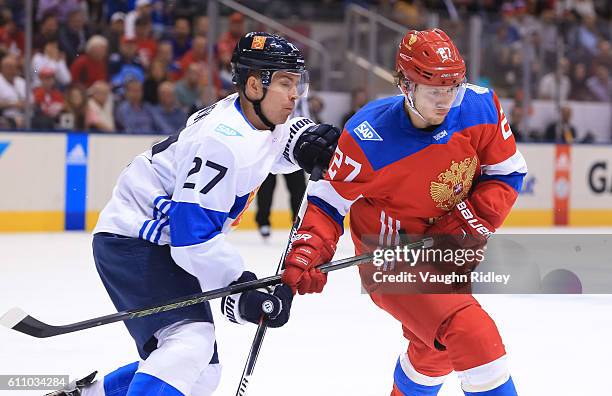 Joonas Donskoi of Team Finland battles for position with Artemi Panarin of Team Russia during the World Cup of Hockey 2016 at Air Canada Centre on...