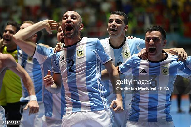 Damian Sarmiento of Argentina celebrates with team mates at the final whistle during the FIFA Futsal World Cup Semi Final match between Argentina and...