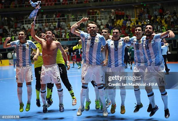 Damian Sarmiento of Argentina celebrates with team mates at the final whistle during the FIFA Futsal World Cup Semi Final match between Argentina and...