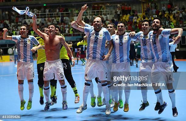 Damian Sarmiento of Argentina celebrates with team mates at the final whistle during the FIFA Futsal World Cup Semi Final match between Argentina and...