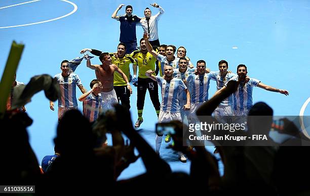 Argentina players celebrate in front of their fans after victory during the FIFA Futsal World Cup semi-final match between Argentina and Portugal at...