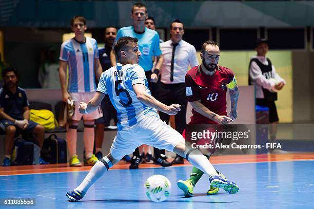 Ricardinho of Portugal plays the ball past Maximiliano Rescia of Argentina during the FIFA Futsal World Cup Semi-Final match between Argentina and...