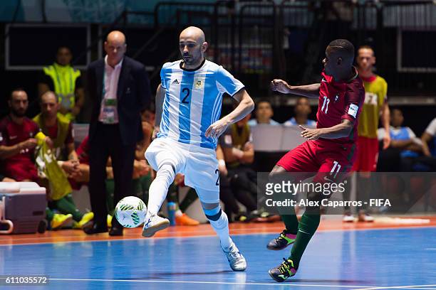 Damian Stazzone of Argentina plays the ball next to Re of Portugal during the FIFA Futsal World Cup Semi-Final match between Argentina and Portugal...
